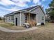 View of the home's side featuring wood porch and durable gray siding at 5 Morning Dove Ct, Clayton, NC 27520
