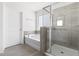 Bright bathroom featuring a soaking tub, tiled shower, and a separate toilet area at 5112 Lizard Tail Ln, Raleigh, NC 27603