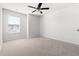 Spacious bedroom with neutral carpet and large window, perfect for relaxation at 5112 Lizard Tail Ln, Raleigh, NC 27603