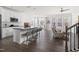 Open kitchen featuring an island with seating, modern appliances, and a seamless flow into the living area at 5112 Lizard Tail Ln, Raleigh, NC 27603