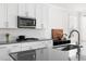 Well-equipped kitchen featuring stainless steel appliances, modern fixtures, and ample counter space at 5112 Lizard Tail Ln, Raleigh, NC 27603