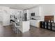 Bright and airy kitchen with white cabinetry, island seating, and modern decor at 5112 Lizard Tail Ln, Raleigh, NC 27603