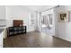 Bright living area with sliding glass doors, modern furnishings, and seamless indoor-outdoor flow at 5112 Lizard Tail Ln, Raleigh, NC 27603
