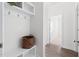 Entryway mudroom with hooks and bench storage; interior door leading to other rooms at 5112 Lizard Tail Ln, Raleigh, NC 27603