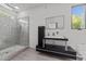 Modern bathroom featuring a glass-enclosed shower, stylish vanity, and a sleek rectangular mirror at 5217 Tanglewild Dr, Raleigh, NC 27613