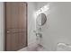 Unique powder room with a glass vessel sink and decorative lighting at 5217 Tanglewild Dr, Raleigh, NC 27613