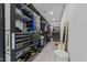 Walk-in closet with custom shelving, hanging rods, and ample space for storage and organization at 5217 Tanglewild Dr, Raleigh, NC 27613