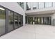 Modern home featuring large windows and a concrete patio at 5217 Tanglewild Dr, Raleigh, NC 27613