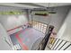 Spacious garage with stylish flooring, spiral staircase, and ample natural light at 5217 Tanglewild Dr, Raleigh, NC 27613