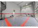 Large garage with epoxy flooring, windows, and overhead door at 5217 Tanglewild Dr, Raleigh, NC 27613