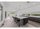 Modern kitchen showcasing a large island with bar stools and sleek, minimalist cabinetry at 5217 Tanglewild Dr, Raleigh, NC 27613