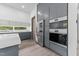 Modern kitchen featuring gray cabinets, stainless steel appliances, and ample natural light at 5217 Tanglewild Dr, Raleigh, NC 27613