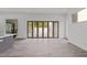 Open living space with expansive folding glass doors that lead outside providing lots of light at 5217 Tanglewild Dr, Raleigh, NC 27613