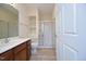 Modern bathroom with a vanity, toilet, and walk-in shower with glass doors at 528 Weather Ridge Ln, Cary, NC 27513