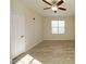 Well-lit bedroom featuring a ceiling fan, window, and neutral color scheme at 528 Weather Ridge Ln, Cary, NC 27513