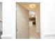 Inviting condo entrance with a chandelier and views of a modern kitchen at 528 Weather Ridge Ln, Cary, NC 27513
