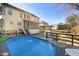 Backyard features an above-ground pool with a deck, pergola, and screened-in porch at 5401 Green Feather Ln, Raleigh, NC 27604