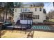 The home's backyard features a pool, deck, and a screened porch with access to the yard at 5401 Green Feather Ln, Raleigh, NC 27604