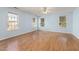 Large bedroom with hardwood floors and windows to let in light at 5401 Green Feather Ln, Raleigh, NC 27604