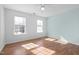 Bedroom with two windows and white trim showing a pleasant street view at 5401 Green Feather Ln, Raleigh, NC 27604