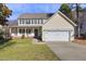 Charming two-story home with a welcoming front porch and attached two-car garage at 5401 Green Feather Ln, Raleigh, NC 27604