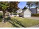 Residential home boasting a well-manicured lawn and a charming covered front porch at 5401 Green Feather Ln, Raleigh, NC 27604