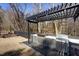 A stainless steel grill station compliments this outdoor kitchen under a modern pergola at 5401 Green Feather Ln, Raleigh, NC 27604