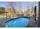 An above-ground pool is surrounded by a deck and seating areas at 5401 Green Feather Ln, Raleigh, NC 27604