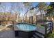 Decked pool area featuring an outdoor kitchen and seating offers a cozy retreat at 5401 Green Feather Ln, Raleigh, NC 27604