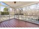 Inviting screened porch boasts a stained wood floor, creating a relaxing outdoor living space at 5401 Green Feather Ln, Raleigh, NC 27604