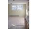 Bright and airy living room boasts neutral carpet, large windows, and electrical outlets for convenience at 5500 Bobbitt Rd, Apex, NC 27539