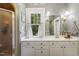 Bathroom featuring white cabinets, a modern sink, and a window for natural lighting at 613 S Fuquay Ave, Fuquay Varina, NC 27526