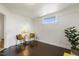 Bright bonus room featuring white walls, dark wood floors, and recessed window detail at 613 S Fuquay Ave, Fuquay Varina, NC 27526