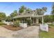 View of home with picket fence, covered entry and carport at 613 S Fuquay Ave, Fuquay Varina, NC 27526