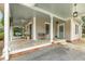 Inviting front porch with ceiling fan, porch swing, and space to sit and relax at 613 S Fuquay Ave, Fuquay Varina, NC 27526