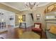 Cozy living room featuring hardwood floors, neutral walls, and an elegant crystal chandelier at 613 S Fuquay Ave, Fuquay Varina, NC 27526