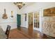 Office area with hardwood floors, chandelier, and entryways to other rooms at 613 S Fuquay Ave, Fuquay Varina, NC 27526