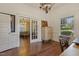 Office space leads to a living area, featuring hardwood floors and chandelier at 613 S Fuquay Ave, Fuquay Varina, NC 27526