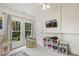 Bright playroom featuring a large window and toys and storage at 613 S Fuquay Ave, Fuquay Varina, NC 27526