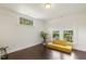 Bright sitting room with hard wood floors, a couch, and multiple windows for lots of natural light at 613 S Fuquay Ave, Fuquay Varina, NC 27526