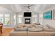 Comfortable living room with vaulted ceilings, a fireplace, and plenty of natural light at 705 Hinsdale St, Raleigh, NC 27605