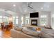 Inviting living room with vaulted ceilings, a fireplace, and an open floor plan at 705 Hinsdale St, Raleigh, NC 27605