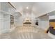 Large walk-in closet features shelving, hanging rods, and carpet at 705 Hinsdale St, Raleigh, NC 27605