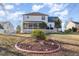 Charming home featuring a spacious backyard with a large deck, ideal for outdoor entertaining at 761 Raymond Dr, Clayton, NC 27527