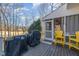 The outdoor deck has plenty of space for seating and a grill, overlooking the yard at 761 Raymond Dr, Clayton, NC 27527