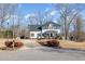 Charming two-story home with classic design, manicured landscaping, and a welcoming front entrance at 761 Raymond Dr, Clayton, NC 27527