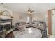 Inviting living room featuring a fireplace, hardwood floors, ceiling fan, and lots of natural light at 761 Raymond Dr, Clayton, NC 27527