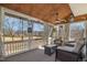 Relaxing screened porch with comfortable seating, ceiling fan, and a view of the backyard at 761 Raymond Dr, Clayton, NC 27527