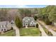 Beautiful aerial view of an estate-style home with mature landscaping and a private driveway at 7709 Moondance Ct, Wake Forest, NC 27587
