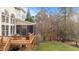 Wooden deck with screened in porch area overlooks the grassy backyard at 7709 Moondance Ct, Wake Forest, NC 27587